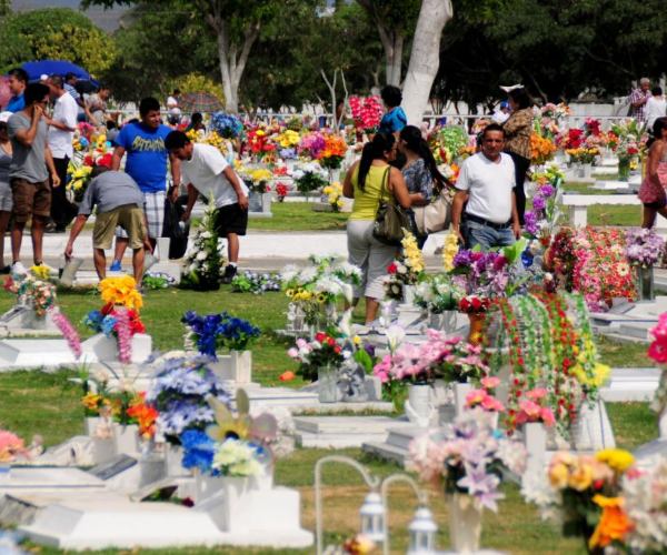 Peru people visit cemeteries to honor and remember moms who have passed away on Mother's Day